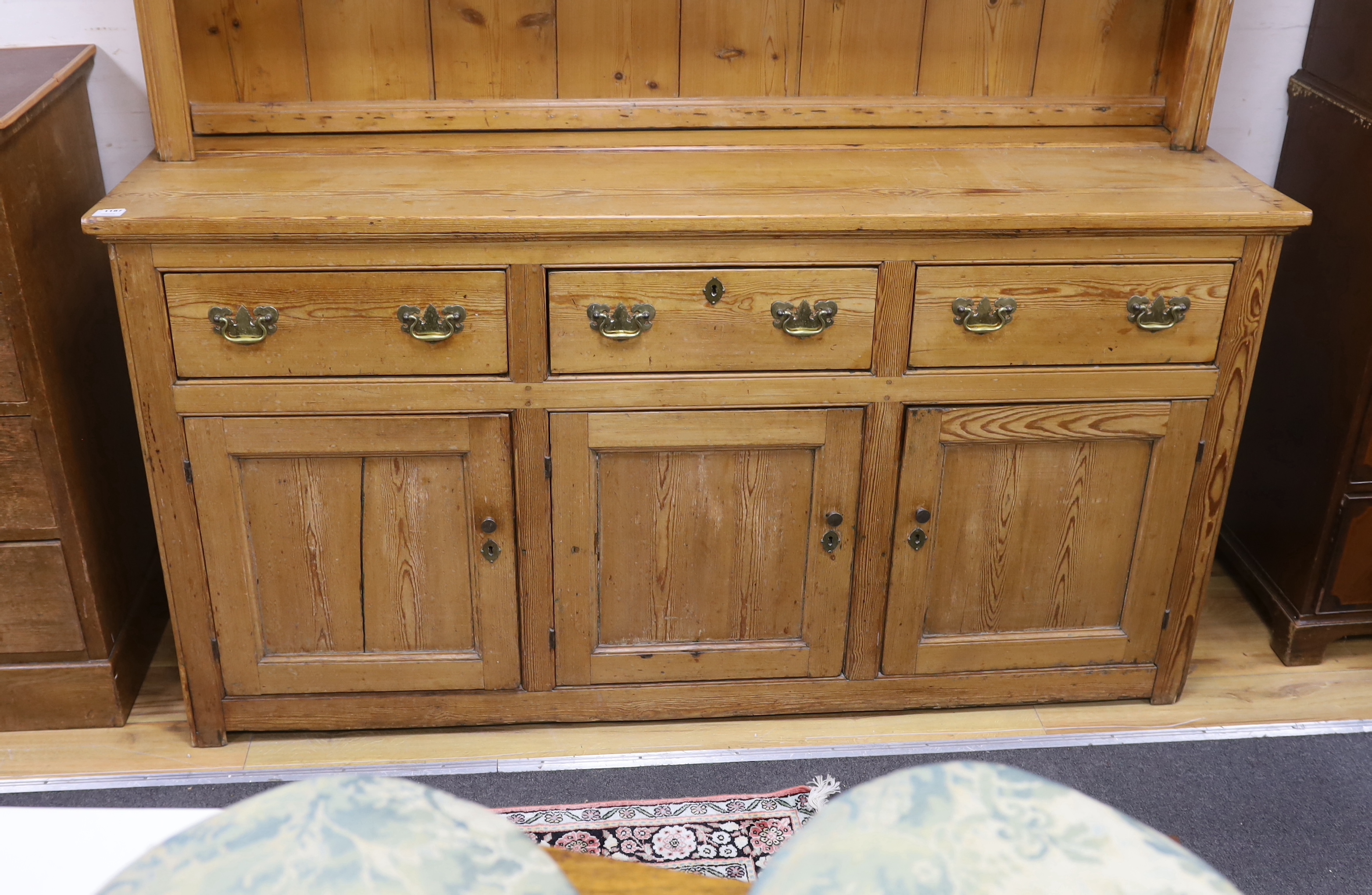 A Victorian pine dresser with boarded rack, width 181cm, depth 51cm, height 206cm